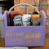 a purple box with some condiments in it