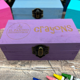 a wooden box with crayons written on it