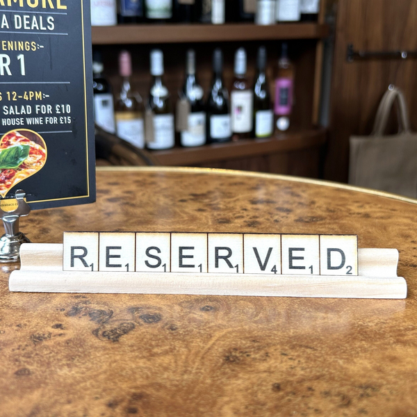 a sign that says reserved on a table