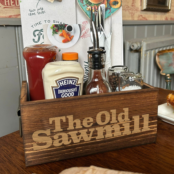 a wooden box filled with food on top of a table