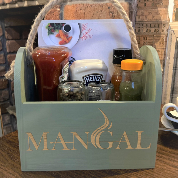 a wooden box filled with condiments and condiments